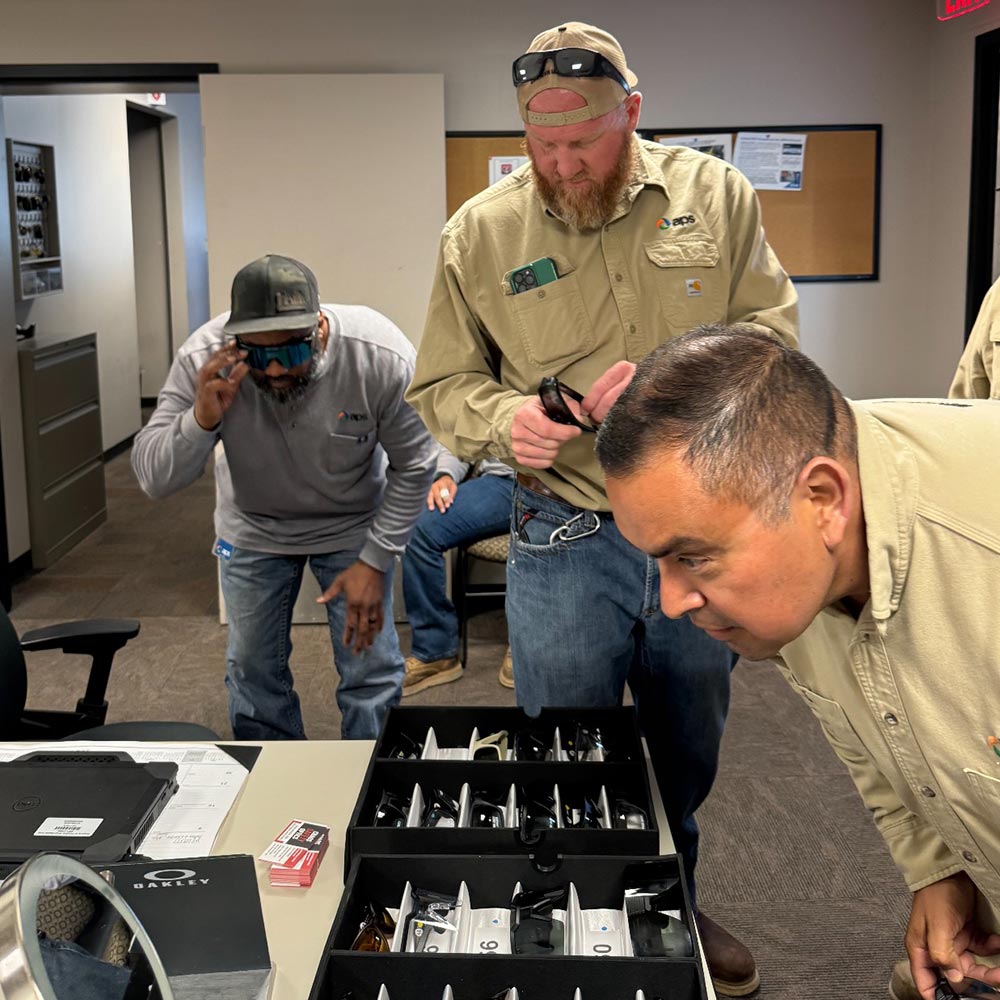 Workers comparing safety eyewear during an on-site Sit and Fit